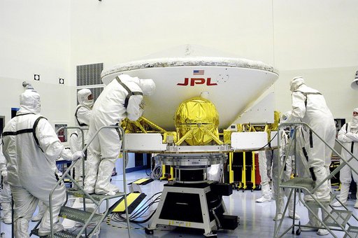 KENNEDY SPACE CENTER, FLA. - In the Payload Hazardous Servicing Facility, workers secure the Mars Exploration Rover-1 (MER-B) to a spin table during preflight processing of the spacecraft.  The rover is scheduled to launch aboard a Delta II rocket on June 25.  NASA’s twin Mars Exploration Rovers are