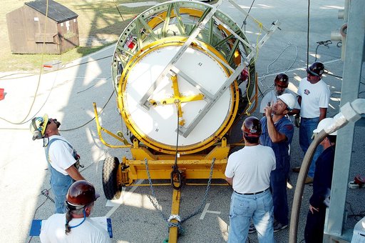 KENNEDY SPACE CENTER, FLA. - The second stage of a Delta II rocket is prepared for lifting up the launch tower on Pad 17-B, Cape Canaveral Air Force Station.  It will be mated to the Delta first stage already at the pad in preparation for the launch of the Mars Exploration Rover-1 (MER-B) on June 25