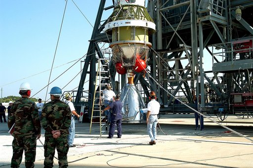 KENNEDY SPACE CENTER, FLA. - The second stage of a Delta II rocket is raised to a vertical position for its lift up the launch tower on Pad 17-B, Cape Canaveral Air Force Station.  It will be mated to the Delta first stage already at the pad in preparation for the launch of the Mars Exploration Rove