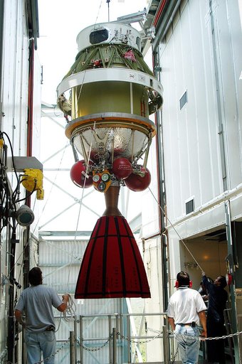 KENNEDY SPACE CENTER, FLA. - The second stage of a Delta II rocket is moved into position at the top of the launch tower on Pad 17-B, Cape Canaveral Air Force Station.  It will be mated to the Delta first stage already at the pad in preparation for the launch of the Mars Exploration Rover-1 (MER-B) 