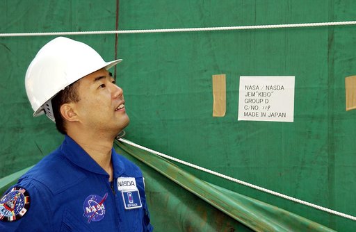 KENNEDY SPACE CENTER, FLA. - Astronaut Soichi Noguchi, with the National Space Development Agency of Japan (NASDA), looks at the Japanese Experiment Module after its arrival at Port Canaveral, Fla.   Built by the Tsukuba Space Center near Tokyo, the pressurized module is the first element of the JEM