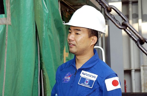 KENNEDY SPACE CENTER, FLA. - Astronaut Soichi Noguchi, with the National Space Development Agency of Japan (NASDA), looks at the Japanese Experiment Module after its arrival at Port Canaveral, Fla.   Built by the Tsukuba Space Center near Tokyo, the pressurized module is the first element of the JEM