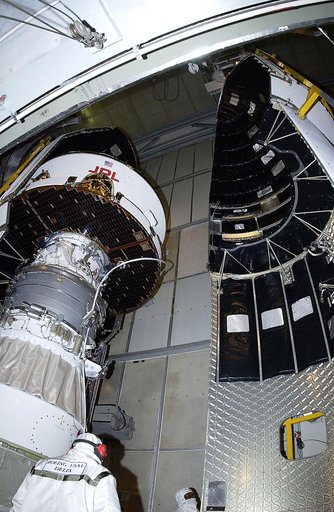 KENNEDY SPACE CENTER, FLA. -  The second half of the fairing is moved toward the Mars Exploration Rover 2 (MER-2) on Launch Complex 17-A, Cape Canaveral Air Force Station.  MER-2 is one of NASA's twin Mars Exploration Rovers designed to study the history of water on Mars. These robotic geologists ar