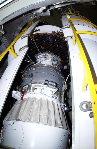 KENNEDY SPACE CENTER, FLA. - The second half of the fairing closes in around the Mars Exploration Rover 2 (MER-2) on Launch Complex 17-A, Cape Canaveral Air Force Station.  MER-2 is one of NASA's twin Mars Exploration Rovers designed to study the history of water on Mars. These robotic geologists ar