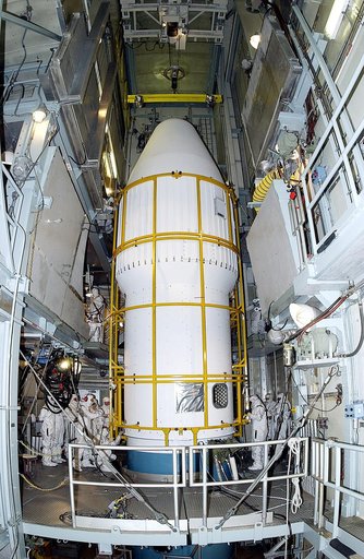 KENNEDY SPACE CENTER, FLA. -  The two halves of the fairing come together around the Mars Exploration Rover 2 (MER-2) on Launch Complex 17-A, Cape Canaveral Air Force Station.  MER-2 is one of NASA's twin Mars Exploration Rovers designed to study the history of water on Mars. These robotic geologist