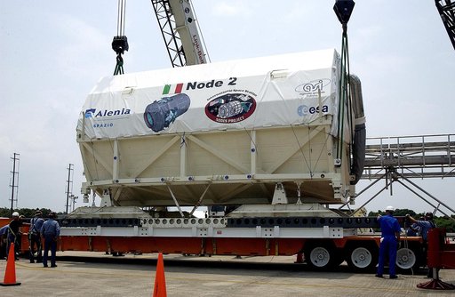 KENNEDY SPACE CENTER, FLA. -  The Italian-built module, U.S. Node 2, is lowered onto a transporter after its arrival at the Shuttle Landing Facility.  It will be taken to the Space Station Processing Facility.  The second of three connecting modules on the International Space Station, Node 2 attache
