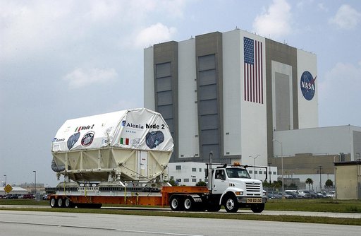 KENNEDY SPACE CENTER, FLA. -  The Italian-built module, U.S. Node 2, moves past the Vehicle Assembly Building as it is transferred to the Space Station Processing Facility. The second of three connecting modules on the International Space Station, Node 2 attaches to the end of the U.S. Lab and provi