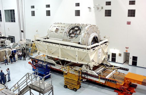 KENNEDY SPACE CENTER, FLA. - The U.S. Node 2 is unveiled after its arrival in the Space Station Processing Facility.  The second of three Station connecting modules, the Italian-built Node 2 attaches to the end of the U.S. Lab and provides attach locations for the Japanese laboratory, European labor
