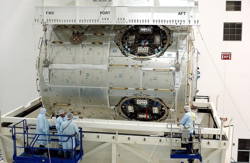 KENNEDY SPACE CENTER, FLA. - An overhead crane in the Space Station Processing Facility lifts the U.S. Node 2 out of its shipping container.  The node will be moved to a workstand.  The second of three connecting modules on the International Space Station, the Italian-built Node 2 attaches to the en