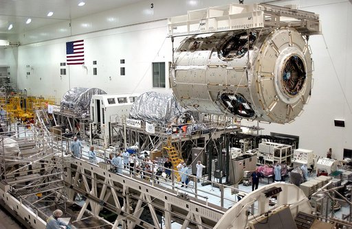 KENNEDY SPACE CENTER, FLA. - The U.S. Node 2 is moved toward a workstand in the Space Station Processing Facility.  The second of three connecting modules on the International Space Station, the Italian-built Node 2 attaches to the end of the U.S. Lab and provides attach locations for the Japanese l