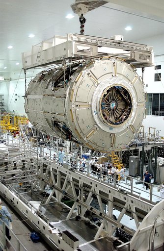 KENNEDY SPACE CENTER, FLA. - The U.S. Node 2 moves toward a workstand in the Space Station Processing Facility.  The second of three connecting modules on the International Space Station, the Italian-built Node 2 attaches to the end of the U.S. Lab and provides attach locations for the Japanese labo