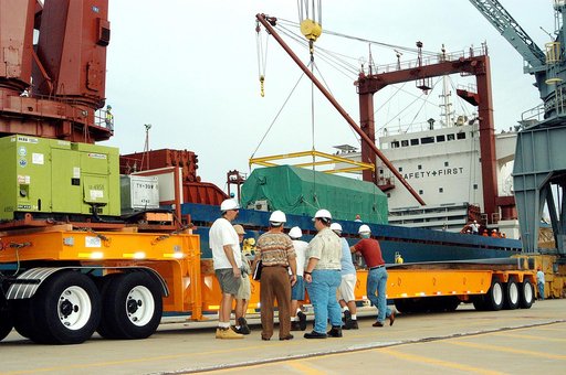 KENNEDY SPACE CENTER, FLA. -  At Port Canaveral, the Pressurized Module of the Japanese Experiment Module (JEM) is lowered onto a truck bed.  The container transport ship carrying JEM departed May 2 from Yokohama Harbor in Japan for the voyage to the United States. The National Space Development Age