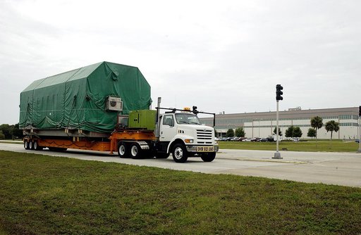 KENNEDY SPACE CENTER, FLA. - The truck transporting the Pressurized Module of the Japanese Experiment Module (JEM) to KSC’s Space Station Processing Facility arrives on Center.  The National Space Development Agency of Japan (NASDA) developed the laboratory at the Tsukuba Space Center near Tokyo. Th