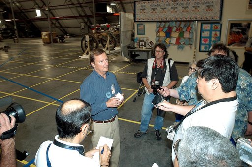 KENNEDY SPACE CENTER, FLA. - In the Columbia Debris Hangar,  Shuttle Launch Director Mike Leinbach  (right) talks to the media about activities that have taken place since the Columbia accident on Feb. 1, 2003.  STS-107 debris recovery and reconstruction operations are winding down.  To date, nearly