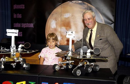 KENNEDY SPACE CENTER, FLA. -  Nine-year-old Sofi Collis (left) is introduced to the media by NASA Administrator Sean O'Keefe at a press conference.   The Siberian-born Arizona resident wrote the winning entry in the Name the Rovers Contest sponsored by NASA and the Lego Co., a Denmark-based toymaker