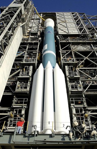 KENNEDY SPACE CENTER, FLA. - On Launch Complex 17-A, Cape Canaveral Air Force Station, the launch tower begins to roll back from the Boeing Delta II rocket and its Mars Exploration Rover (MER-A) payload in preparation for a second attempt at launch.  The first attempt on June 8, 2003, was scrubbed d