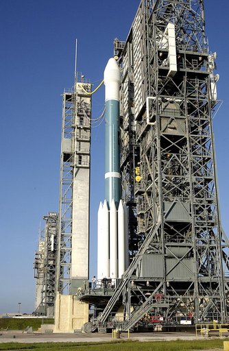 KENNEDY SPACE CENTER, FLA. -  On Launch Complex 17-A, Cape Canaveral Air Force Station, the launch tower begins to roll back from the Boeing Delta II rocket and its Mars Exploration Rover (MER-A) payload in preparation for a second attempt at launch.  The first attempt on June 8, 2003, was scrubbed 