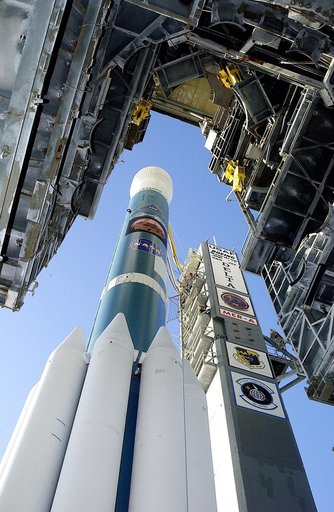KENNEDY SPACE CENTER, FLA. -   The Boeing Delta II rocket and its Mars Exploration Rover (MER-A) payload is viewed from under the launch tower as it moves away on Launch Complex 17-A, Cape Canaveral Air Force Station.  This will be a second attempt at launch.  The first attempt on June 8, 2003, was 