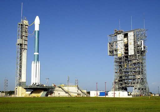 KENNEDY SPACE CENTER, FLA. -    The launch tower (right) on Launch Complex 17-A, Cape Canaveral Air Force Station, has been rolled back from the Boeing Delta II rocket and its Mars Exploration Rover (MER-A) payload (left) in preparation for a second attempt at launch.  The first attempt on June 8, 2