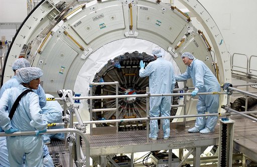 KENNEDY SPACE CENTER, FLA. -  Workers in the Space Station Processing Facility look over the hatch on the Italian-built Node 2, a future element of the International Space Station.  Node 2 arrived at KSC June 1.  The second of three Station connecting modules, the module  attaches to the end of the 