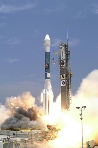 KENNEDY SPACE CENTER, FLA. - Amid billows of smoke and steam, the Delta II rocket with its Mars Exploration Rover (MER-A) payload lifts off the pad on time at 1:58 p.m. EDT from Launch Complex 17-A, Cape Canaveral Air Force Station. MER-A, known as "Spirit," is the first of two rovers being launched