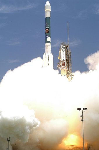 KENNEDY SPACE CENTER, FLA. - Leaving smoke and steam behind, the Delta II rocket with its Mars Exploration Rover (MER-A) payload lifts off the pad on time at 1:58 p.m. EDT from Launch Complex 17-A, Cape Canaveral Air Force Station. MER-A, known as "Spirit," is the first of two rovers being launched 
