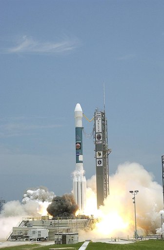 KENNEDY SPACE CENTER, FLA. - Blue sky and sun give a dramatic backdrop for the launch of  the Delta II rocket with its Mars Exploration Rover (MER-A) payload.  Liftoff occurred on time at 1:58 p.m. EDT from Launch Complex 17-A, Cape Canaveral Air Force Station. MER-A, known as "Spirit," is the first