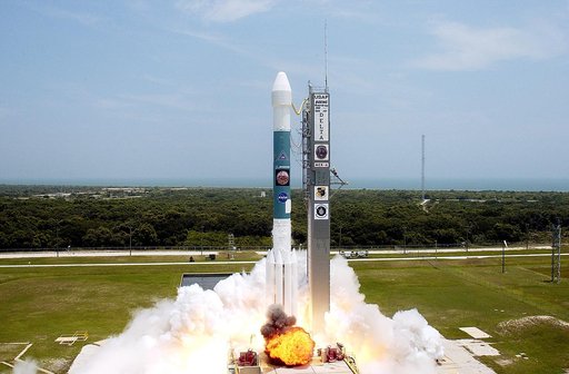 KENNEDY SPACE CENTER, FLA. -  With a glimpse of the Atlantic Ocean over the horizon, the Delta II rocket with its Mars Exploration Rover (MER-A) payload leaps off the launch pad into the blue sky to begin its journey to Mars.  Liftoff occurred on time at 1:58 p.m. EDT from Launch Complex 17-A, Cape 