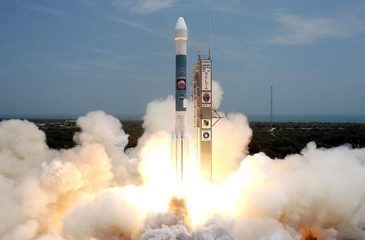 KENNEDY SPACE CENTER, FLA. -   Surrounded by smoke and steam, the Delta II rocket with its Mars Exploration Rover (MER-A) payload hurtles through it into the blue sky to begin its journey to Mars.  Liftoff occurred on time at 1:58 p.m. EDT from Launch Complex 17-A, Cape Canaveral Air Force Station. 