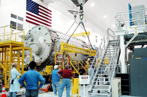 KENNEDY SPACE CENTER, FLA. - In the Space Station Processing Facility, overhead cranes are removed from the Japanese Experiment Module (JEM) pressure module now on its work stand.  A research laboratory, the pressurized module is the first element of the JEM, named "Kibo" (Hope), to be delivered to 