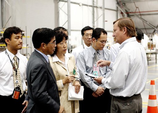KENNEDY SPACE CENTER, FLA. -   Shuttle Launch Director Mike Leinbach (right) explains recovery and reconstruction efforts of Columbia to the Executive Director of NASDA Koji Yamamoto (second from left) and others visiting the Columbia Debris Hangar.   Mr. Yamamoto is at KSC for a welcome ceremony in
