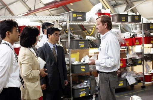 KENNEDY SPACE CENTER, FLA. -  Shuttle Launch Director Mike Leinbach (right) explains recovery and reconstruction efforts of Columbia to the Executive Director of NASDA Koji Yamamoto (third from left) and others visiting the Columbia Debris Hangar.   Mr. Yamamoto is at KSC for a welcome ceremony invo
