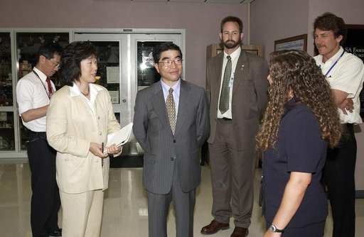 KENNEDY SPACE CENTER, FLA. -  In the Space Station Processing Facility, Executive Director of NASDA Koji Yamamoto (center) joins others for a tour.  Mr. Yamamoto is at KSC for a welcome ceremony involving the arrival of the newest Space Station module, the Japanese Experiment Module/pressurized modu