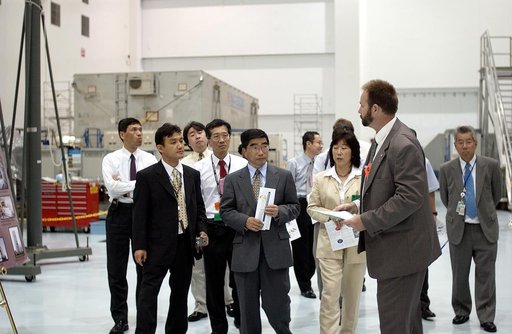 KENNEDY SPACE CENTER, FLA. -  In the Space Station Processing Facility, Executive Director of NASDA Koji Yamamoto (center) joins others for a tour.  Mr. Yamamoto is at KSC for a welcome ceremony involving the arrival of the newest Space Station module, the Japanese Experiment Module/pressurized modu