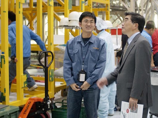 KENNEDY SPACE CENTER, FLA. -  In the Space Station Processing Facility, Executive Director of NASDA Koji Yamamoto (right) looks at the newly arrived Japanese Experiment Module (JEM)/pressurized module.  Mr. Yamamoto is at KSC for a welcome ceremony involving the arrival of JEM.