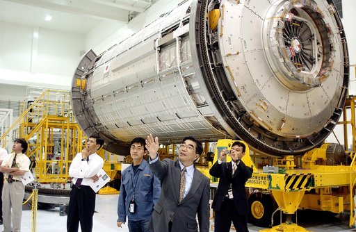 KENNEDY SPACE CENTER, FLA. -  In the Space Station Processing Facility, Executive Director of NASDA Koji Yamamoto points to other Space Station elements.  Behind him is the Japanese Experiment Module (JEM)/pressurized module.  Mr. Yamamoto is at KSC for a welcome ceremony involving the arrival of JE