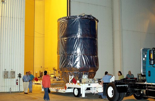 KENNEDY SPACE CENTER, FLA. -  The Mars Exploration Rover 1 (MER-B) is moved  out of the Payload Hazardous Servicing Facility for transfer to Launch Pad 17-B, Cape Canaveral Air Force Station.  The second of twin rovers being sent to Mars, it is equipped with a robotic arm, a drilling tool, three spe
