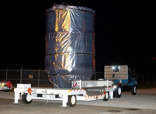 KENNEDY SPACE CENTER, FLA. -  The Mars Exploration Rover 1 (MER-B) is moved  out of the Payload Hazardous Servicing Facility for transfer to Launch Pad 17-B, Cape Canaveral Air Force Station.  The second of twin rovers being sent to Mars, it is equipped with a robotic arm, a drilling tool, three spe