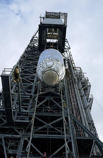 KENNEDY SPACE CENTER, FLA. -   On Launch Pad 17-B, Cape Canaveral Air Force Station, the Mars Exploration Rover 1 (MER-B) is lifted up the tower for mating with the Delta rocket.  The second of twin rovers being sent to Mars, it is equipped with a robotic arm, a drilling tool, three spectrometers, a