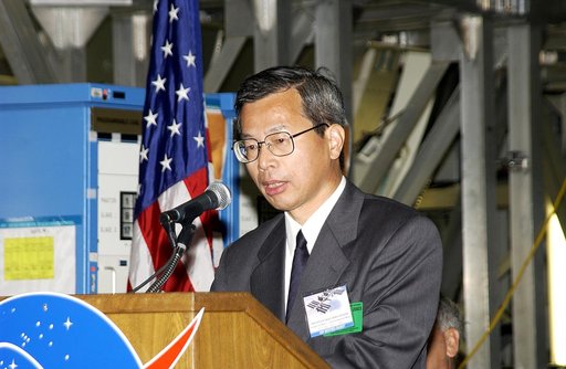 KENNEDY SPACE CENTER, FLA. -  Kuniaki Shiraki, JEM Project manager, National Aerospace and Development Agency of Japan,  speaks to guests and the media gathered in the Space Station Processing Facility at a ceremony highlighting the arrival of two major components of the International Space Station.