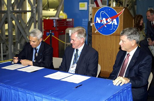 KENNEDY SPACE CENTER, FLA. - Andrea Lorenzoni, International Space Station Program manager for Node 2, Italian Space Agency; Alan Thirkettle, International Space Station Program manager for Node 2, European Space Agency (ESA); and NASA’s Michael C. Kostelnik, deputy associate administrator for Inter