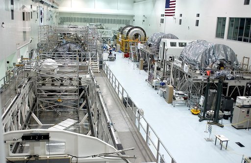KENNEDY SPACE CENTER, FLA. -  International Space Station elements being processed for launch on upcoming Space Shuttle flights line the walls of the high bay in the Space Station Processing Facility. NASA's Node 2, built by the European Space Agency (ESA) in Italy, arrived at KSC on June 1. It will