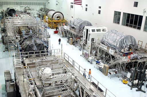 KENNEDY SPACE CENTER, FLA. -  International Space Station elements being processed for launch on upcoming Space Shuttle flights line the walls of the high bay in the Space Station Processing Facility. NASA's Node 2, built by the European Space Agency (ESA) in Italy, arrived at KSC on June 1. It will