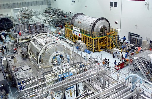 KENNEDY SPACE CENTER, FLA. -  International Space Station elements being processed for launch on upcoming Space Shuttle flights, including the U.S. Node 2 and the Japanese Experiment Module (JEM) pressurized module, line the walls of the high bay in the Space Station Processing Facility. NASA's Node