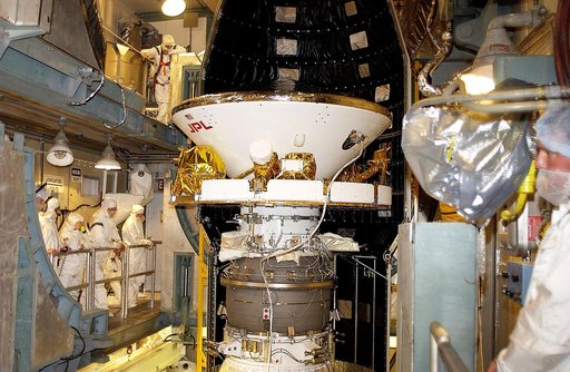 KENNEDY SPACE CENTER, FLA. - At Launch Complex 17-B, Cape Canaveral Air Force Station, workers prepare to encapsulate the Mars Exploration Rover-1 (MER-B) into its spacecraft fairing. The second of twin rovers being sent to Mars, it is equipped with a robotic arm, a drilling tool, three spectrometer
