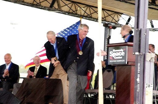 KENNEDY SPACE CENTER, FLA. -  At the KSC Visitor Complex, former astronaut Frederick H. (Rick) Hauck (standing right) congratulates former astronaut Daniel Brandenstein (standing center) at his induction ceremony into the U.S. Astronaut Hall of Fame. Also standing is former astronaut James A. Lovell