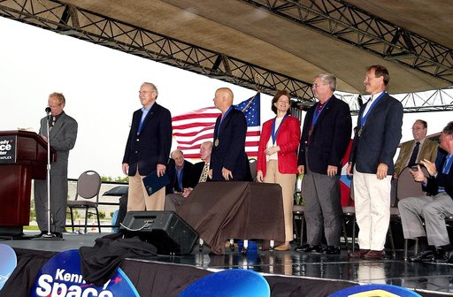 KENNEDY SPACE CENTER, FLA. -  At the KSC Visitor Complex, actor and Master of Ceremonies Lance Henriksen (at podium) introduces four newly inducted Space Shuttle astronauts to the audience at their induction ceremony into the U.S. Astronaut Hall of Fame. From left center, they are Story Musgrave, Sa