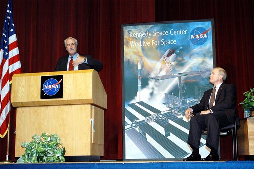 KENNEDY SPACE CENTER, FLA. -  NASA Administrator Sean O'Keefe addresses a group of KSC employees assembled in the KSC Training Auditorium. KSC Director Roy D. Bridges (right) also spoke.  The occasion is the announcement of James W. Kennedy as the next director of the NASA Kennedy Space Center (KSC)