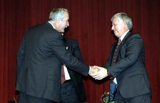 KENNEDY SPACE CENTER, FLA. -  NASA Administrator Sean O'Keefe (left) congratulates James W. Kennedy (right)  before a group of KSC employees assembled in the KSC Training Auditorium.  The occasion is the announcement of Kennedy as the next director of the NASA Kennedy Space Center (KSC) in Florida. 