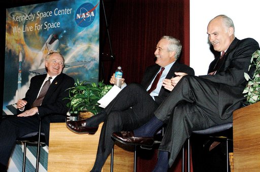 KENNEDY SPACE CENTER, FLA. -  From left, KSC Director Roy D. Bridges, NASA Administrator Sean O'Keefe, and NASA Associate Administrator of Space Flight William F. Readdy share a light moment on the stage in the KSC Training Auditorium. The occasion is the announcement of James W. Kennedy as the next
